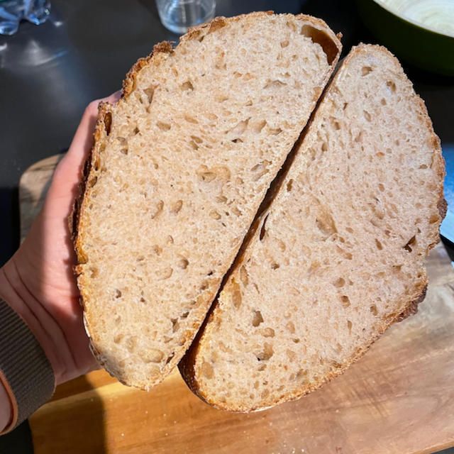 sourdough bread after baking cut in two halfs